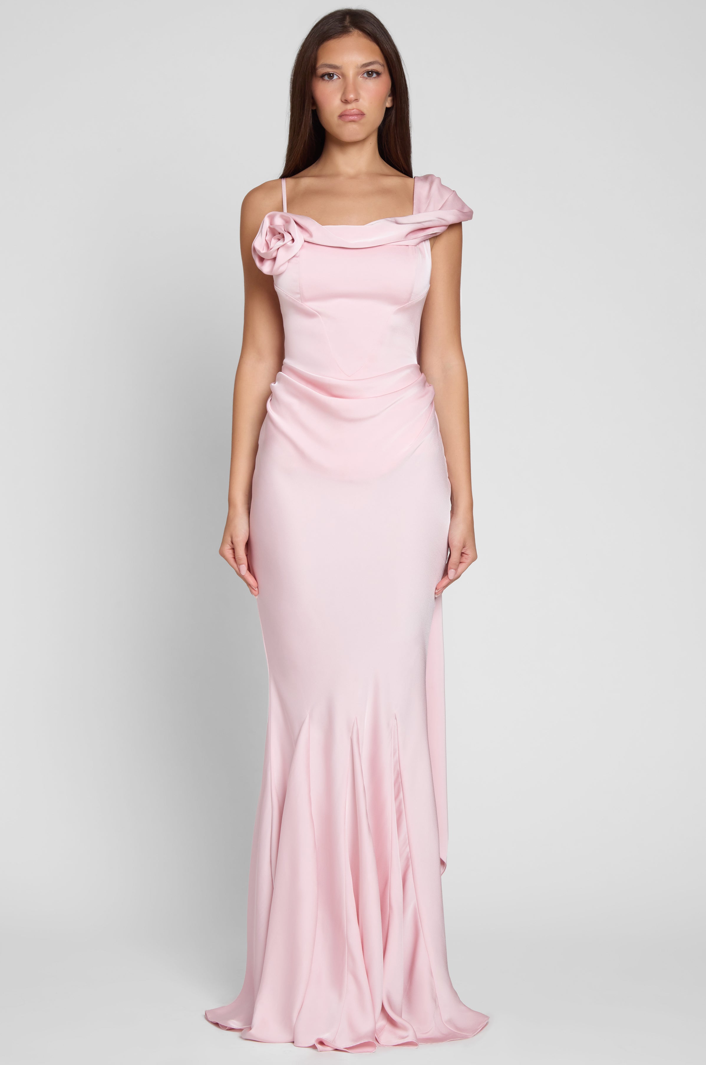 Model is wearing Celine Corset Drape Satin Gown in Pink, front view.