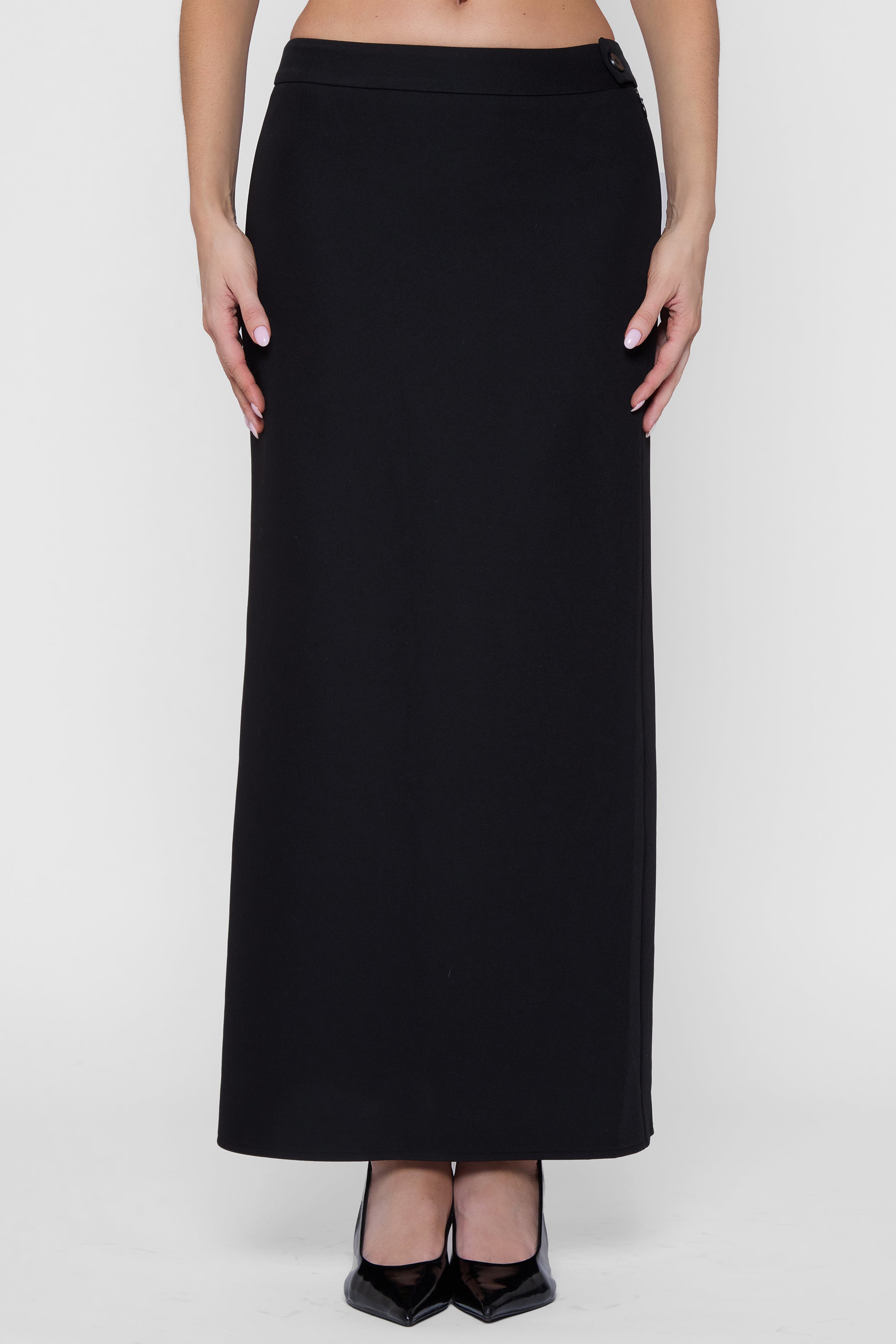 Model wearing Classic Column Maxi Skirt in Black, front view.