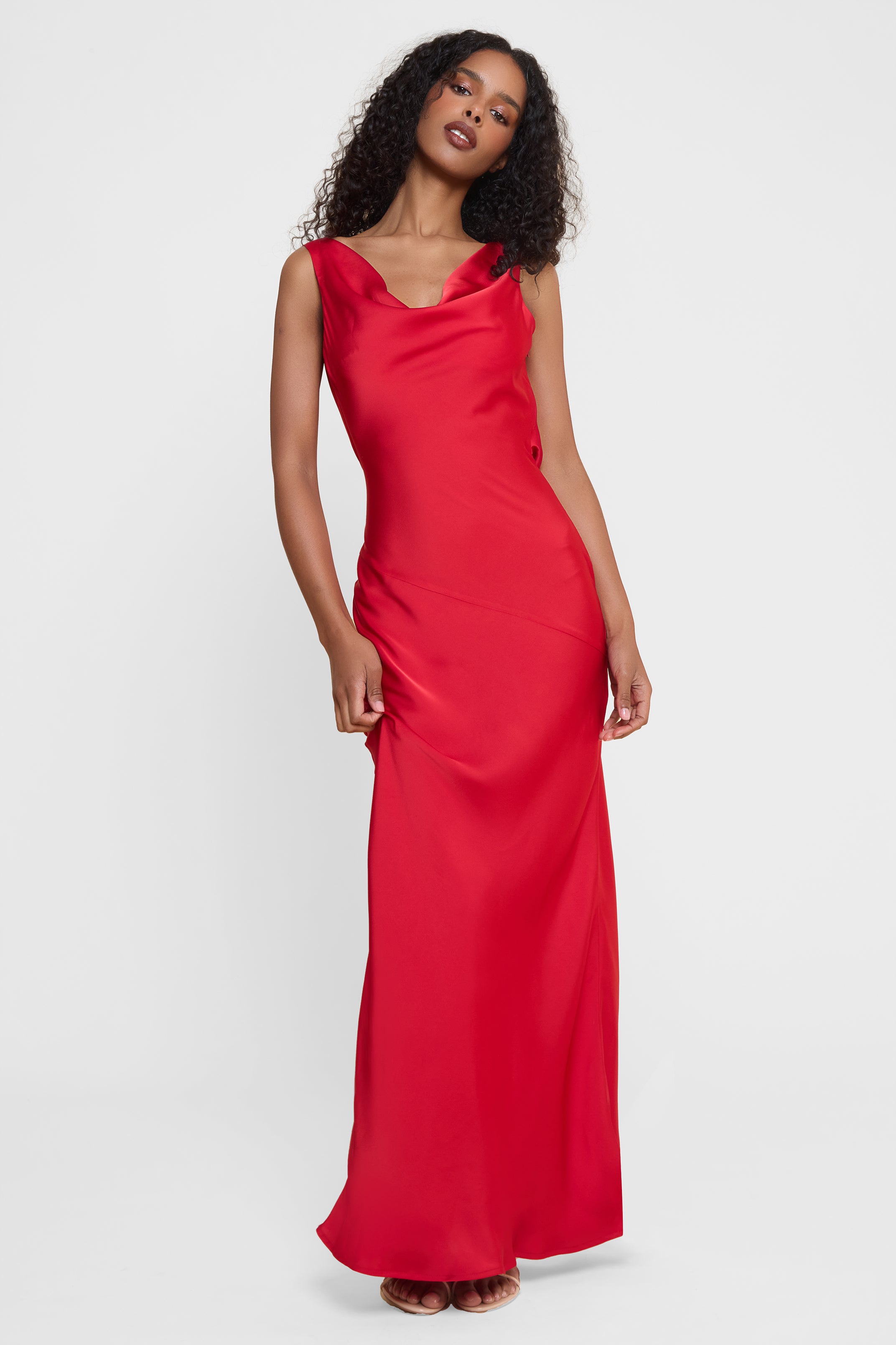 Model wearing Dove Drape Satin Gown in Red, front view.