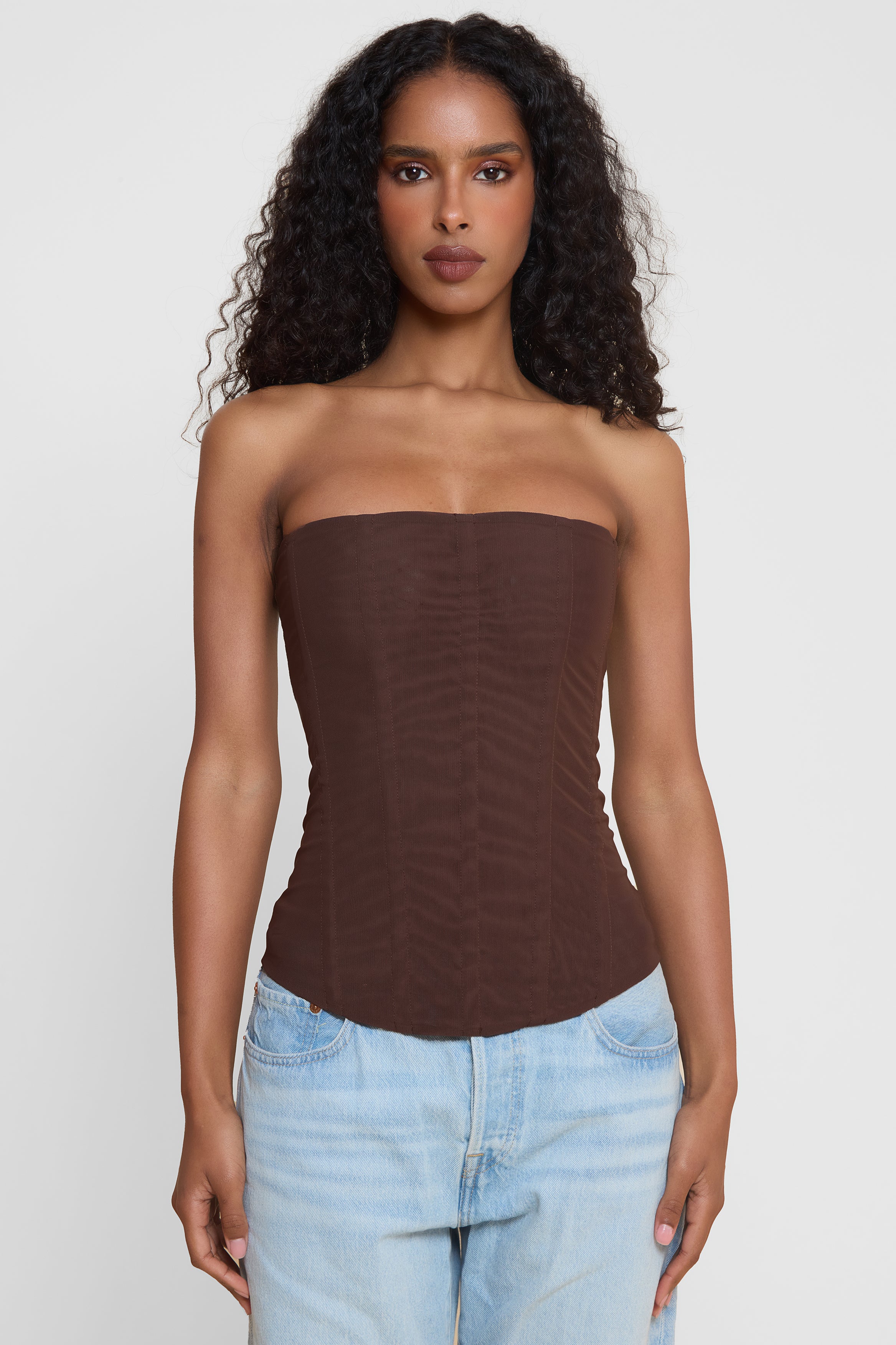 Model wearing Muse Mesh Corset Top in Chocolate Brown, front view.