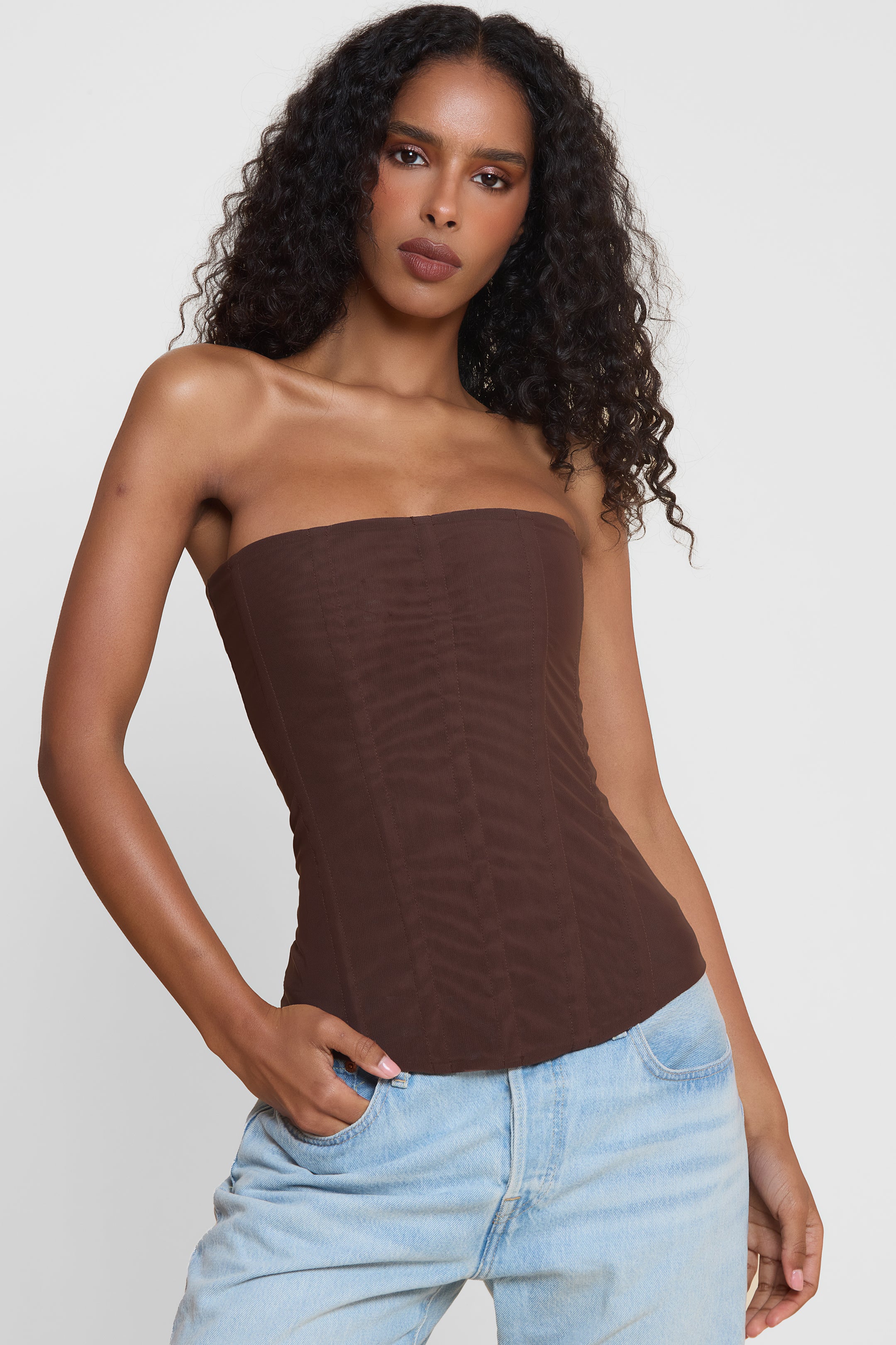 Model wearing Muse Mesh Corset Top in Chocolate Brown, front view.