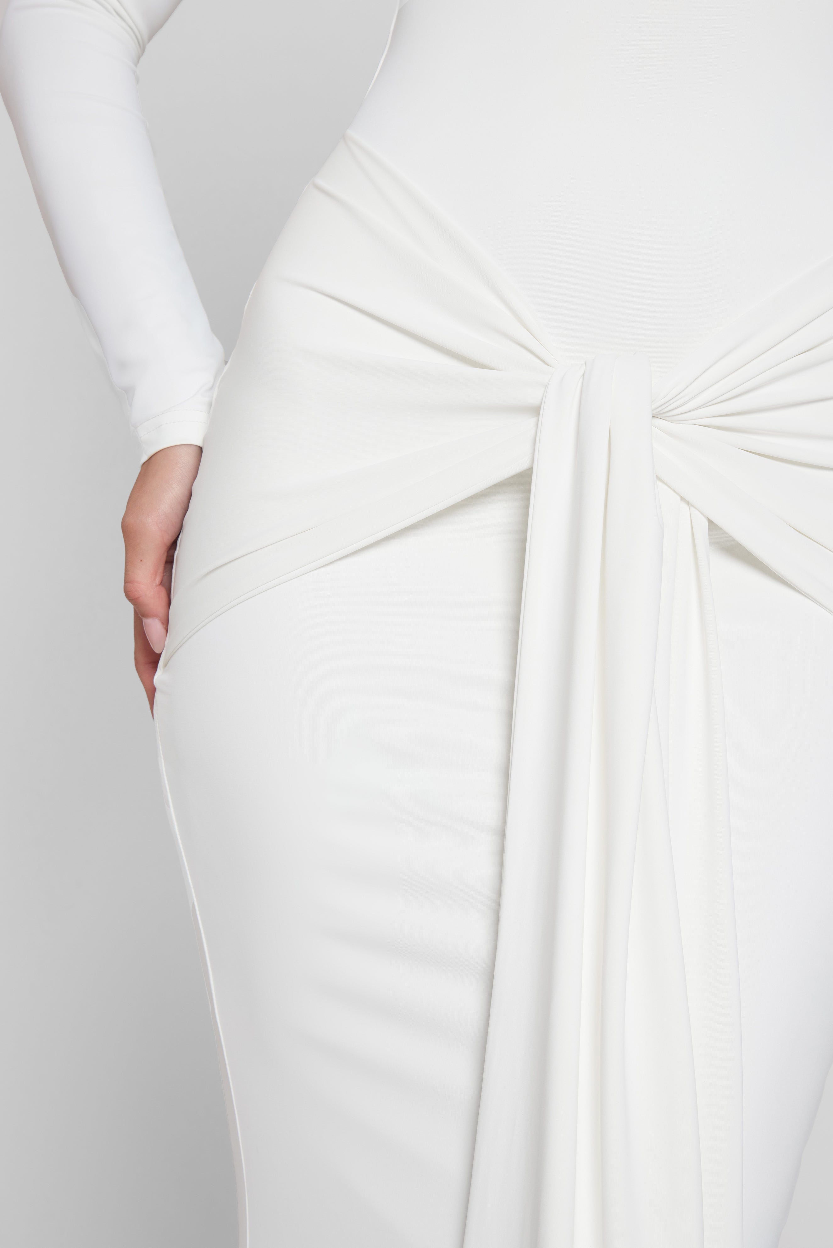 Model is wearing Oasis Knot Maxi Dress in White, front view.