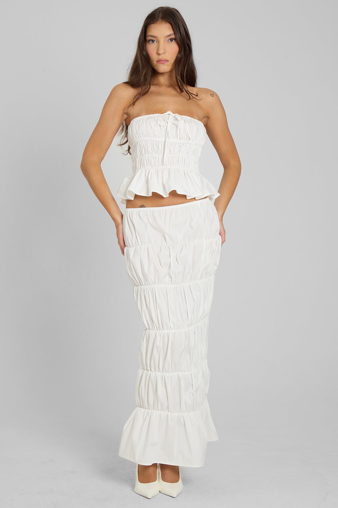 Model wearing Reverie Ruffle Two Piece Set in White, front view.
