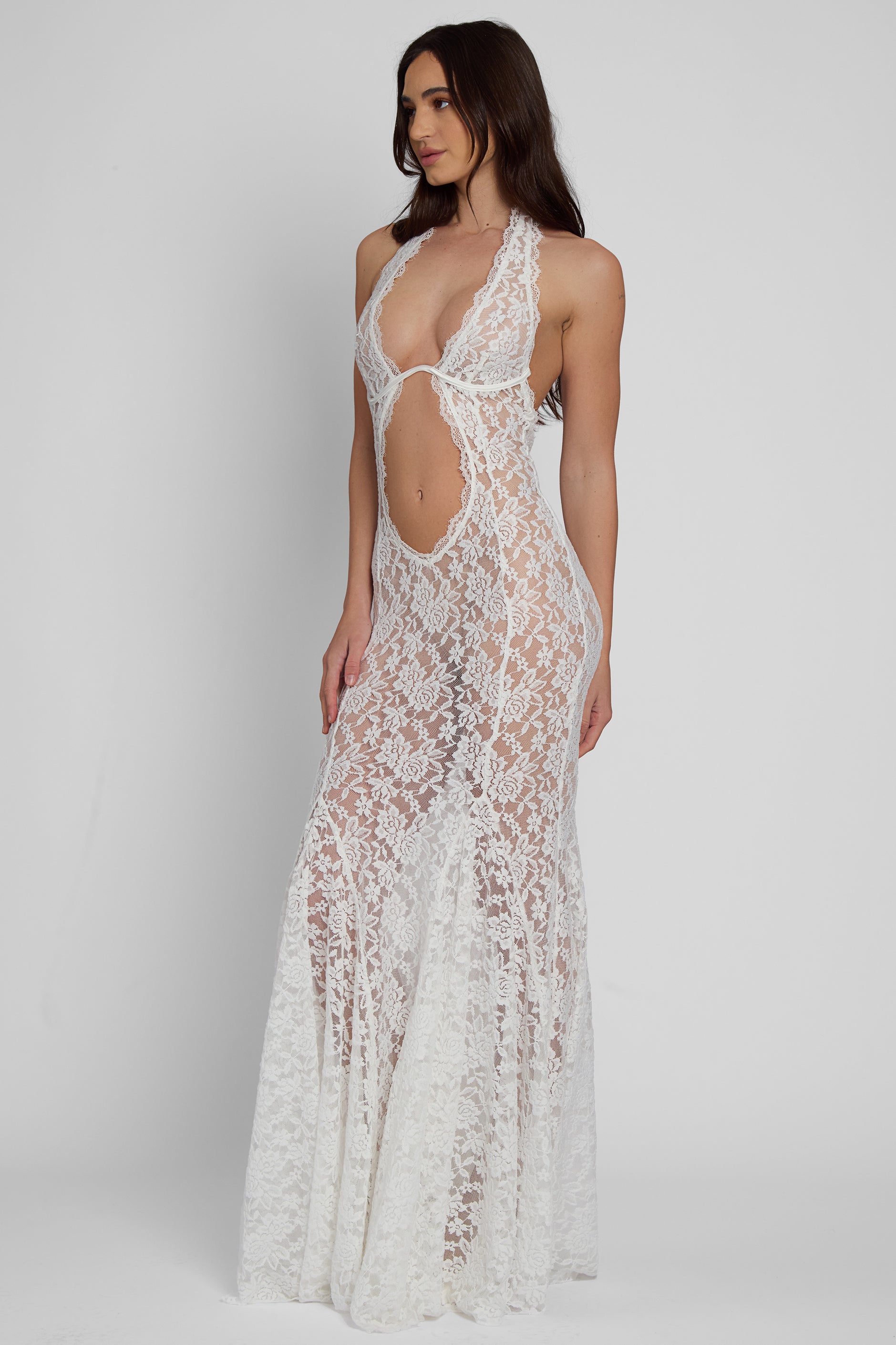Model wearing Saltair Lace Bustier Maxi Dress in White, side view.