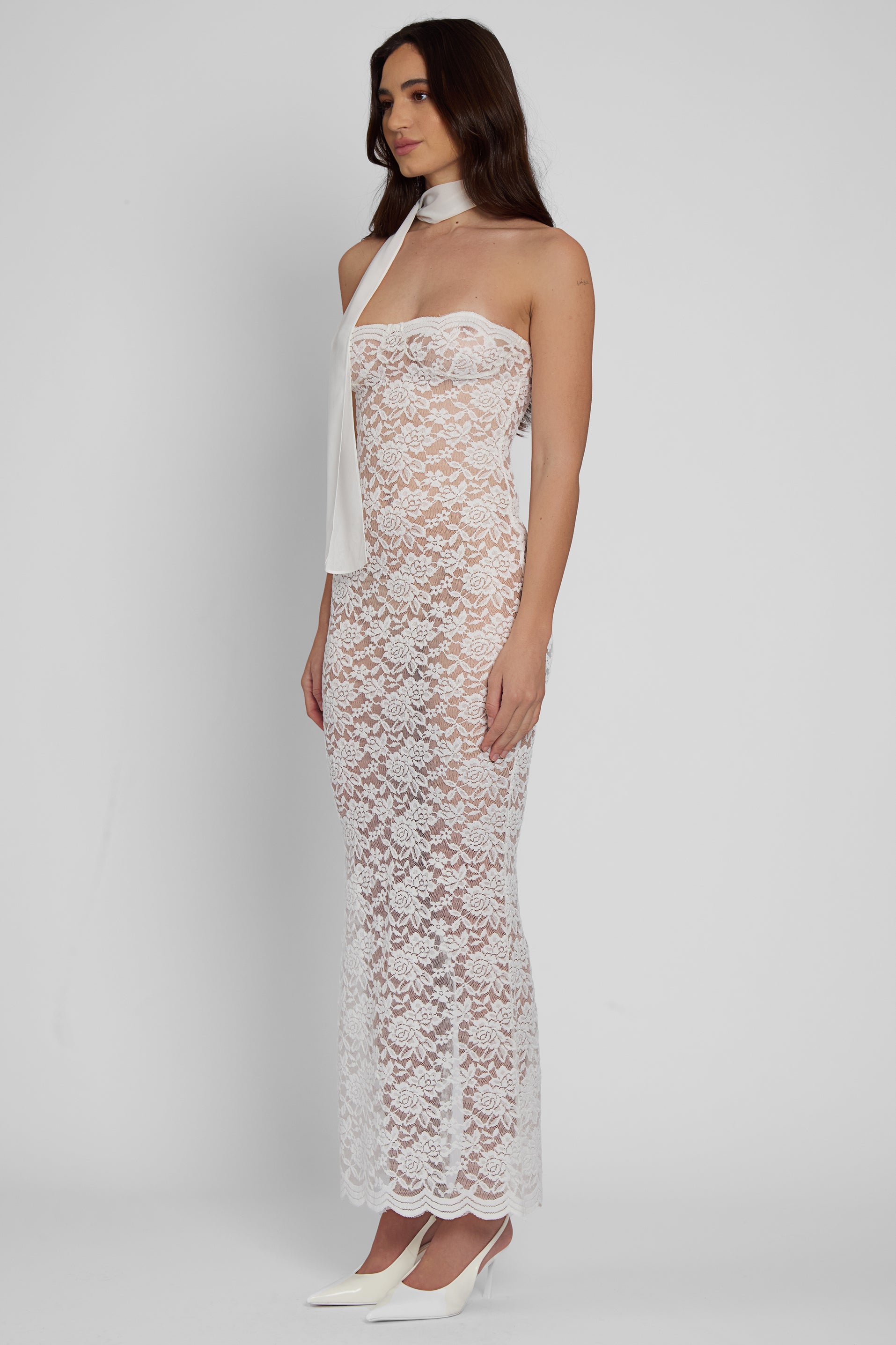 Model wearing Soleil Scalloped Lace Midi Dress in White, side view.